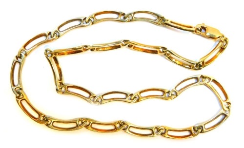 A fancy link neck chain, arched form with pierced central design, yellow metal stamped 375, 42cm long, 21.7g.