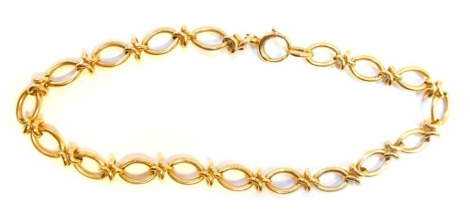 A fancy link bracelet, with oval links with joined cross section links, yellow metal stamped 375, 20cm long, 10.4g.