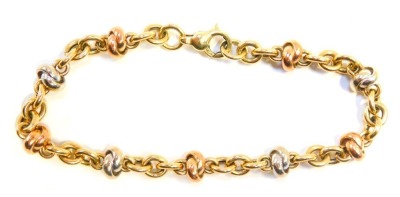 A bicolour bracelet, the knotted links in rose and white gold, with yellow gold curb links, 18cm long, yellow metal stamped 375, 10.4g.