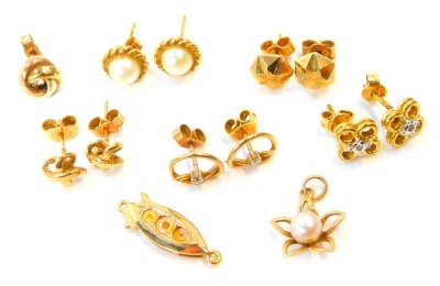 A group of 9ct gold and other earrings and clasps, studs, cultured pearl sets and others, 10.9g all in.