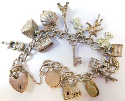 A group of silver and other wares, comprising a silver ingot pendant, silver charm bracelet with assortment of charms, silver curb link chain, 120.4g all in, and a pair of unmarked cufflinks. - 2