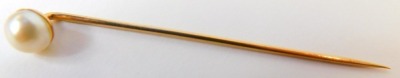 A cultured pearl stick pin, the single cream finish pearl, on a yellow metal frame, unmarked believed to be 9ct, 6cm long, in R&W Bird of Grantham box. - 2