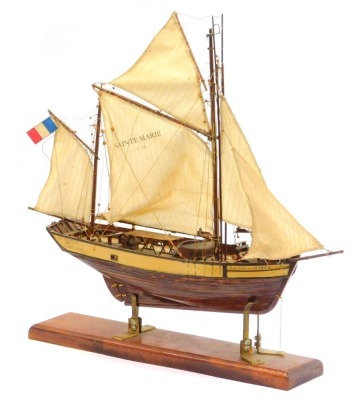 A wooden model of a fishing boat, named The Sainte Marie, La Rochelle 1883 Tunny Boat L24, on an oak stand, 68cm high.