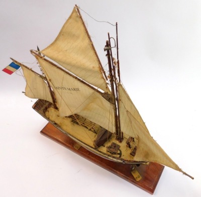 A wooden model of a fishing boat, named The Sainte Marie, La Rochelle 1883 Tunny Boat L24, on an oak stand, 68cm high. - 2