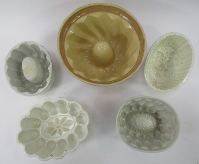 A group of 19thC and later pottery jelly moulds, to include a 20thC painted example, 23cm diameter. - 2