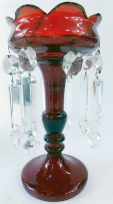 Two similar late 19thC ruby glass lustres, each with a turreted top, on a twisted and gilded stem, on circular foot, with faceted glass drops, 28cm high. (2, AF) - 6