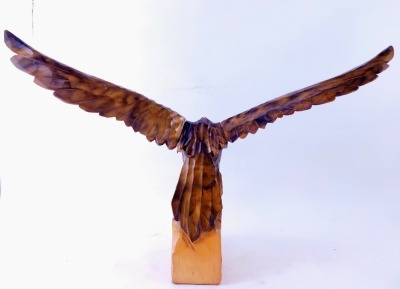 A carved wooden figure of an eagle, perched on ragged rock, with detachable wings, 52cm high, 71cm wide. - 2