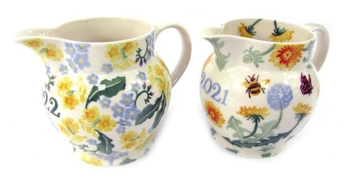 Two Emma Bridgewater pottery one and a half pint jugs, comprising Forget Me Not and Primrose Year jug 2022, and Dandelion Year jug 2021.