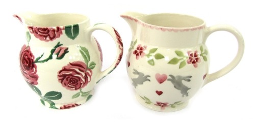 Two Emma Bridgewater pottery one and a half pint jugs, comprising Pink Roses Year jug 2020, and Lovebirds Year jug 2023.