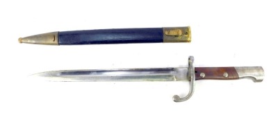 A Brazilian 1908 pattern bayonet, with wooden handle, and black leather and brass scabbard, numbered e6767, length of blade 30cm.