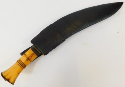 An Indian Kukri, with bone handle and curved steel blade, in black leather scabbard, length of blade 32.5cm. - 6