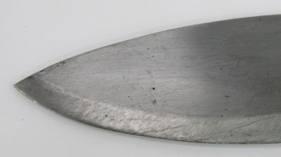 An Indian Kukri, with horn handle and curved steel blade, in leather scabbard, length of blade 24cm. - 2