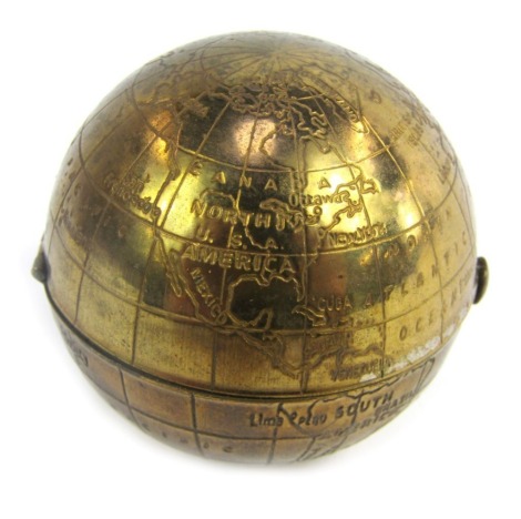 A mid century Pygmalion powder compact, modelled as a globe, the hinged lid with mirror inset to top, the base with blotter, etc., 6cm wide.