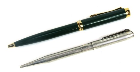 A Marksman ballpoint pen, in green casing with gold coloured trim, together with a mid century propelling pencil, with engine turned decoration, London 1953. (2)