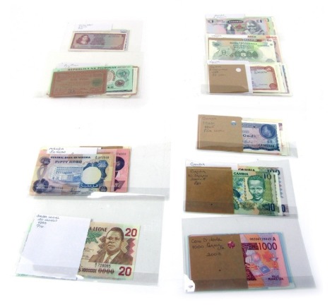 A group of world banknotes, for South Africa, the Philippines, East Africa to include Kenya, Uganda, Zambia, West Africa to include Nigeria, Ghana, Gambia, Ivory Coast, etc.