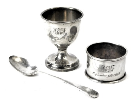 A George V silver Christening set, comprising egg cup, spoon and napkin ring, each engraved AEJ September 9th 1928, Birmingham 1928, 1.52oz, in fitted case.