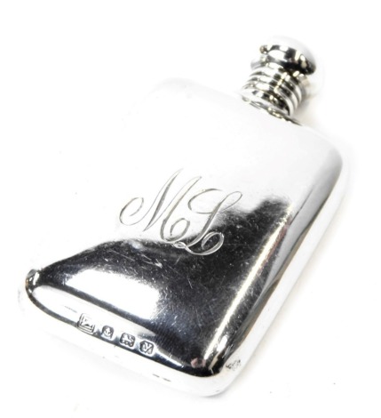 A George V silver miniature hip flask, with a twisted steam bearing the initials ML, Birmingham 1923, 7cm high, 0.89oz.