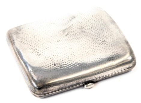 A George V silver cigarette case, with hammered design, maker S M & Co, London, 1925, 3.17oz.