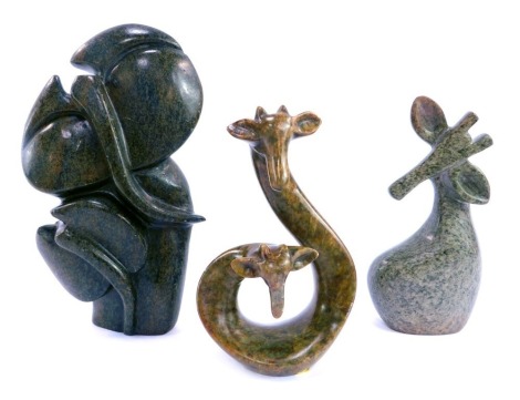 A hardstone figure group depicting mother and baby elephant, by Mike Muza, 21cm high, and a similar giraffe group by the same artist, 16cm high, and a further carved hardstone abstract giraffe.