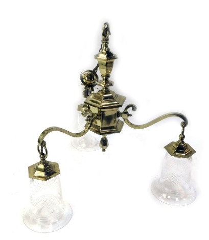 An Edwardian brass three branch chandelier, with three glass shades, drop approx 76cm, 54cm wide.