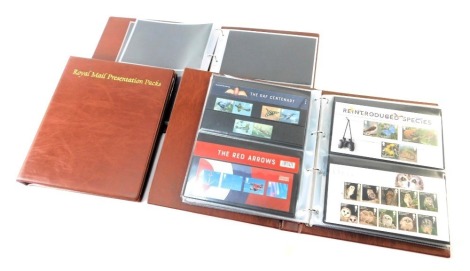 Presentation packs, comprising an album circa 2012 onwards, Harry Potter, Beatrix Potter, Christmas, D-Day and Navy Ships, and two empty album. (3 albums)