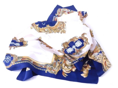 A 1960s/1970s silk scarf, on a blue ground with gold floral rococo style border, in the Hermes style, 75.5cm x 80cm.