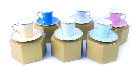 Six Faberge Royal Collection cups and saucers, with gilded rims and handles, in presentation boxes. (6)