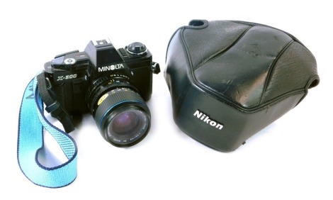 A Minolta X300 camera, with Carl Zeiss Jena 35-70mm Jenazoom 2 lens.