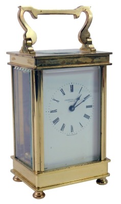 J Hawton and Son of London. 20thC brass cased anniversary clock, with swing handle, white enamel Roman numeric dial, seventeen jewel movement, on bun feet, 12cm high, 7.5cm wide, 6cm deep.