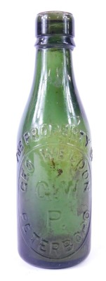 A Geo Weldon of Peterborough glass bottle, no.1744,21cm high.