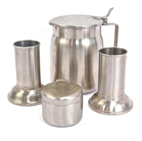 A group of United States Army Medical Corps Vollrath smallwares, comprising stainless steel coffee pot, two beakers, and a jar and cover in stainless steel. (4)