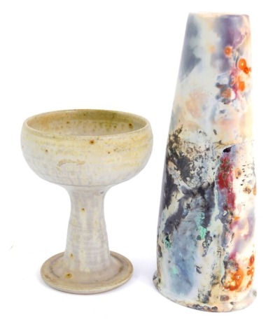 Studio pottery, comprising a grey mottled finish goblet, 14.5cm high, and a cylindrical vase, with marbled effect decoration, 24cm high, bearing PP stamp to underside. (2)