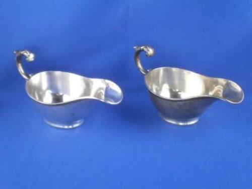 A pair of silver sauce boats