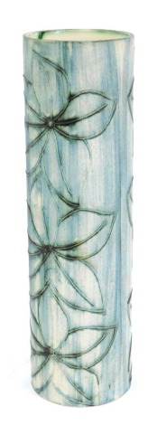 A Cairn Pottery of Penzance Cornwall studio pottery cylindrical vase, on a blue ground decorated and raised with three flowers, 30cm high.