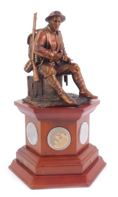 A Danbury Mint WWI Centenary commemorative figure, entitled The Brave British Tommy, the figure on a hexagonal base inset with commemorative coins, 28cm high, with certificate of authenticity no. 2088