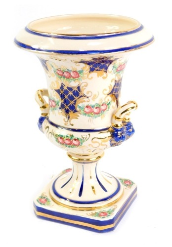 A Jafferose Italian pottery campana vase, decorated with roses, gilt heightened cobalt blue hatching, on a square base, 27cm high.