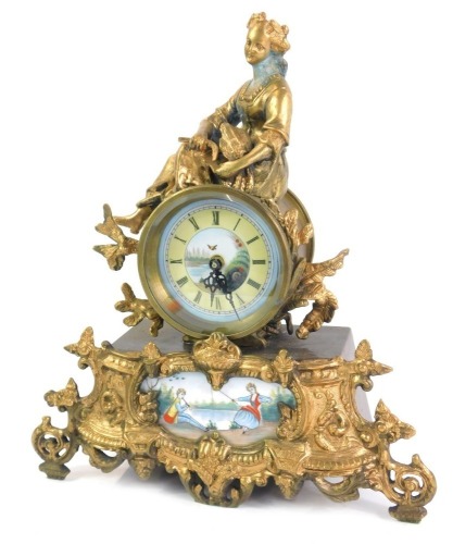 A 19thC French style mantel clock, the circular dial bearing Roman numerals above a painted panel of figures fishing and playing instruments, the case surmounted with a seated figure of lady with corn, a tapering rectangular base, set to the front with a