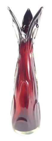 A 20thC ruby Art Glass vase, with three point top, with flared and raised body, on a red ground, 47cm high.