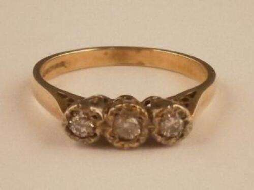 A three stone diamond set ring