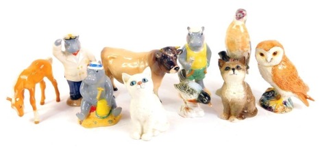 A collection of ceramic animals, comprising a Beswick Dunsley Coy Boy cow, Beswick tan foal, two Beswick cats, a Beswick owl, three Beswick Hippo Holiday figures, Par Hippo, Grandpa Hippo and Hugo Hippo, and two Continental porcelain birds. (10)