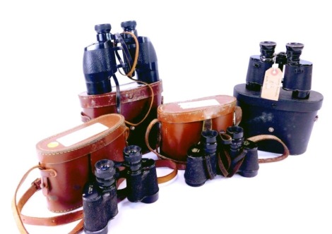 Four pairs of binoculars in a leather case, comprising Auteuil 8x26 binoculars, Nikon 8x30 binoculars, Ray Clearvu 8x30 binoculars, and a set of Ross London 9x35 binoculars, each in leather case. (4)