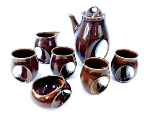 A Holkham pottery brown glazed coffee set T112, comprising coffee pot, four cups, milk jug and sugar bowl.