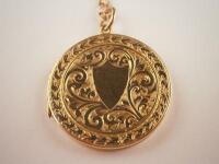 A circular engraved locket