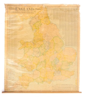 An early 20thC Scarborough Publishing Company's map of England and Wales, applied on material backing, with pine hanging stake, 108cm x 90cm. (AF)