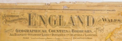 An early 20thC Scarborough Publishing Company's map of England and Wales, applied on material backing, with pine hanging stake, 108cm x 90cm. (AF) - 2