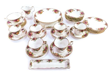 A Royal Albert Old Country Roses pattern part tea service, comprising six cups and saucers, one breakfast cup, six side plates, rectangular pin dish, milk jug, six bowls, large fruit bowl and a cake plate.