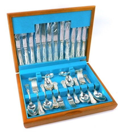 A Flexi Fit King's shell pattern silver plated six place setting canteen of cutlery, in a fitted teak case.