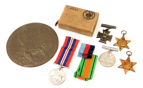 A WWI bronze dead man's penny awarded to Albert Arthur Margrie, "B" COY.66 BN. Machine Gun Corps (Infantry), who died on 30th September 1918, aged 26 years old, commemorated at The Valencie Nes (St.Roch) Communal Cemetery, IV.A.18, and WWII medals, 1939-4