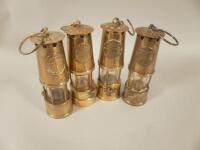 Four brass Protector Miners Lamps