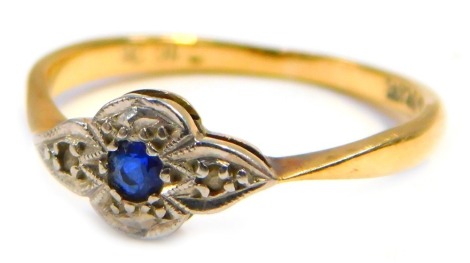 An Art Deco dress ring, the white gold set with tiny diamonds with a central sapphire, pave set in white gold, on a yellow metal ring band stamped 18ct plat, ring size N½, 1.6g all in.